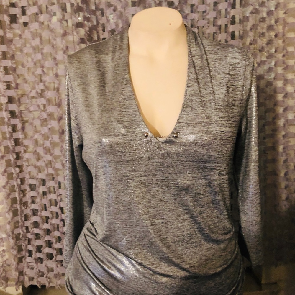 Shiny silver woman’s top NWT.